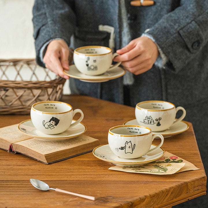 Japanese-style ceramic coffee cup and saucer set with cute cartoon cat illustrations – 280ml white mug with hand-drawn details
