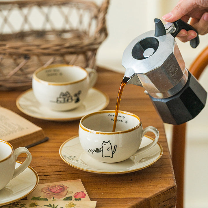 Japanese-style ceramic coffee cup and saucer set with cute cartoon cat illustrations – 280ml white mug with hand-drawn details

