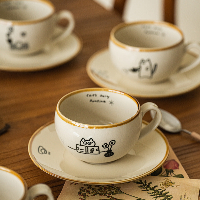 Japanese-style ceramic coffee cup and saucer set with cute cartoon cat illustrations – 280ml white mug with hand-drawn details
