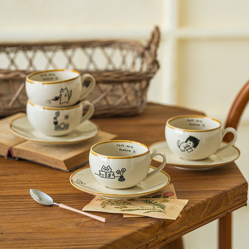 Japanese-style ceramic coffee cup and saucer set with cute cartoon cat illustrations – 280ml white mug with hand-drawn details
