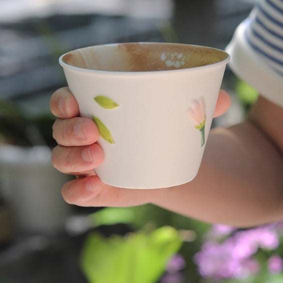 Handmade ceramic tea cup with delicate pink flower and green leaf detailing – 250ml minimalist mug for green tea or coffee